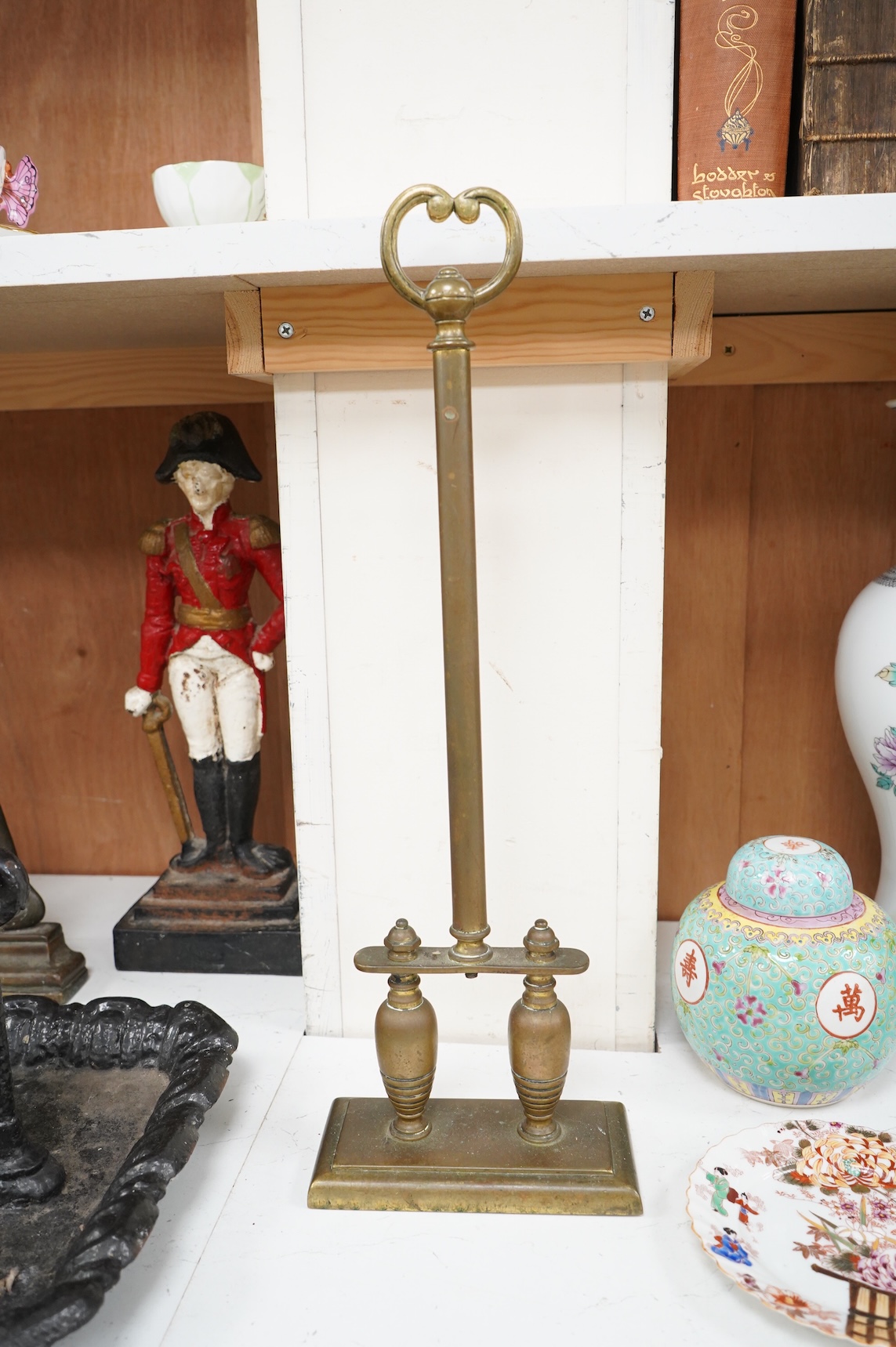 A collection of various metal wares to include door stops, boot scraper, spelter figure etc, largest 49cm high
